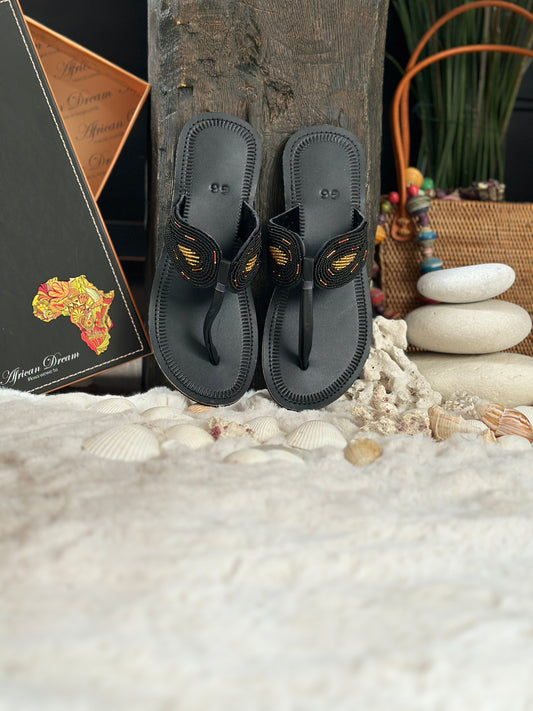 Malajka black fekete bőr fekete arany anygalszárny mintás afrikai papucs lapos talppal újjbebújós flip-flop