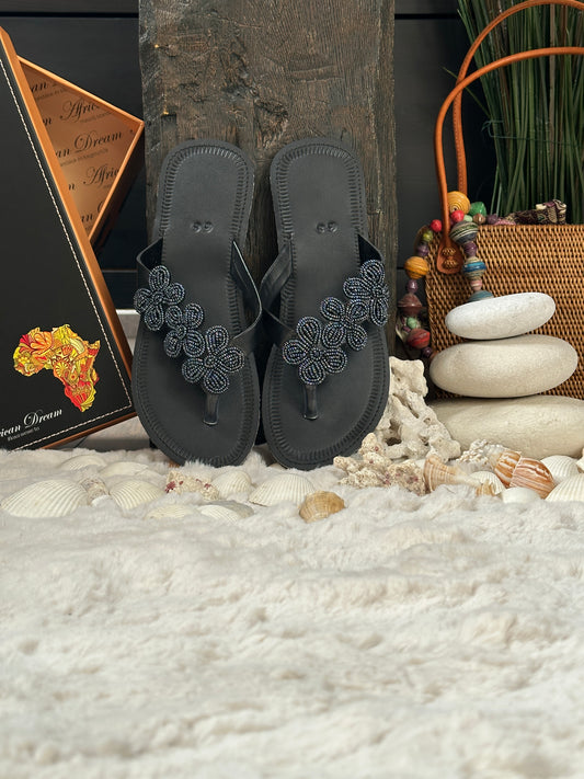 Nafula fekete bőr fekete három kis virág mintás afrikai papucs lapos talppal újjbebújós flip-flop